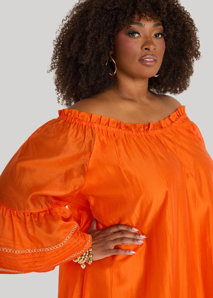 Vestido bordado con hombros descubiertos